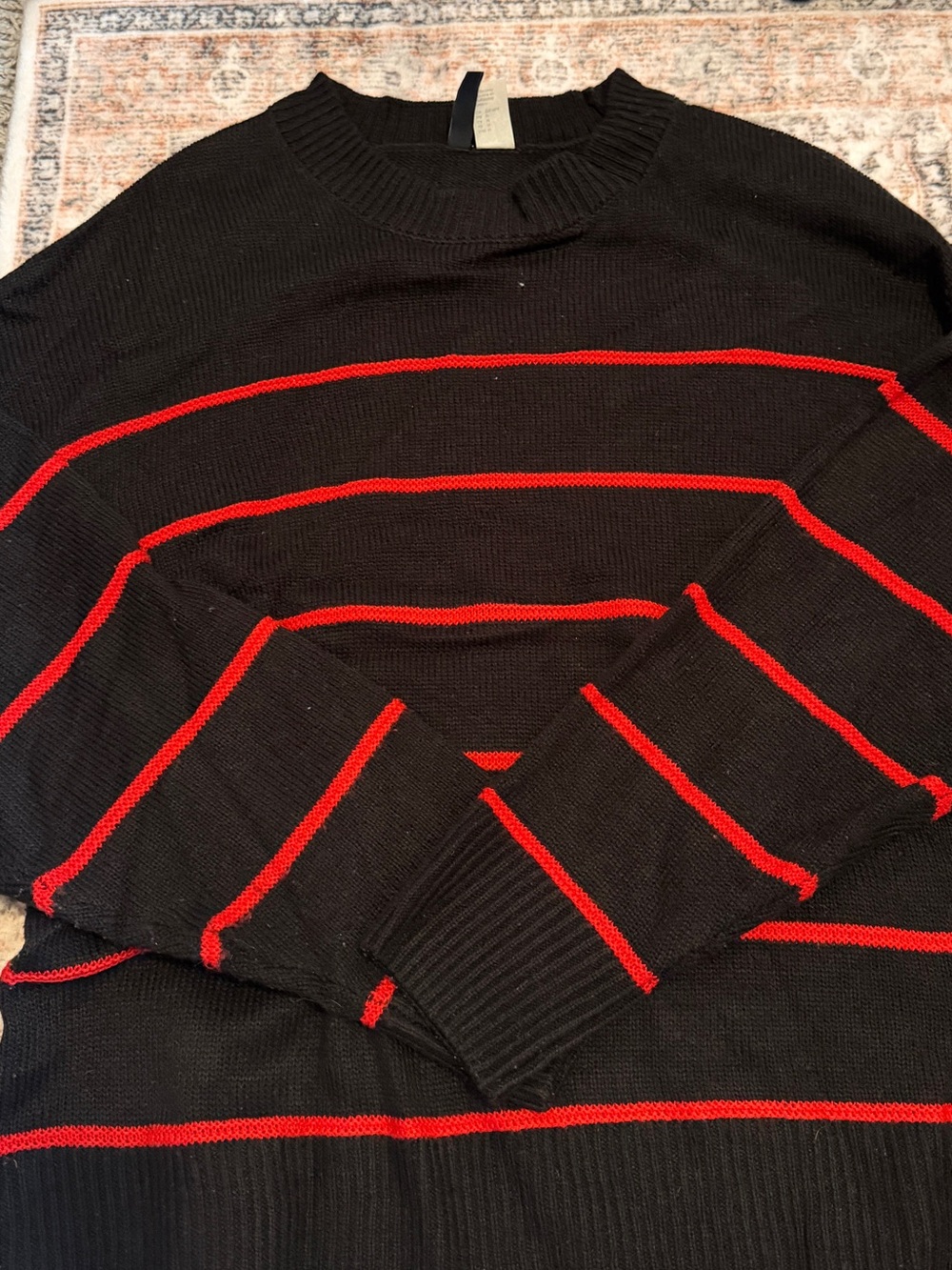 Divided Black Crewneck Sweater with Red Stripes